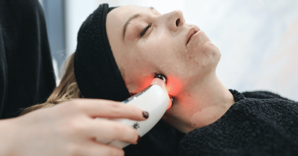 a girl getting treatment through illuminage skin smoothing laser