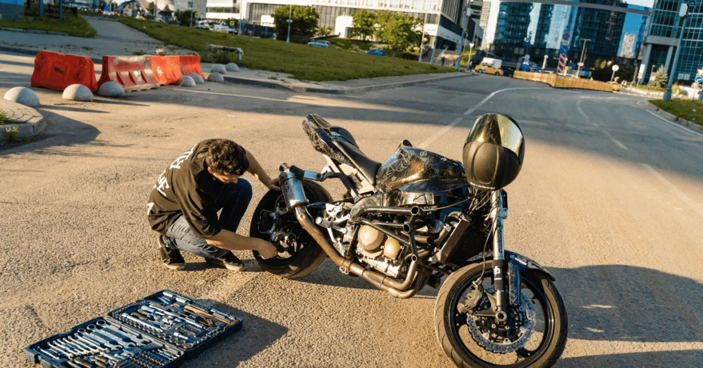 how to start a roadside assistance business without towing. A biker repairing the bike on roadside